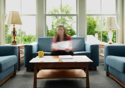 woman sitting on couch in suite lounge