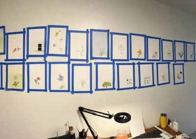 photos of artwork hanging on wall