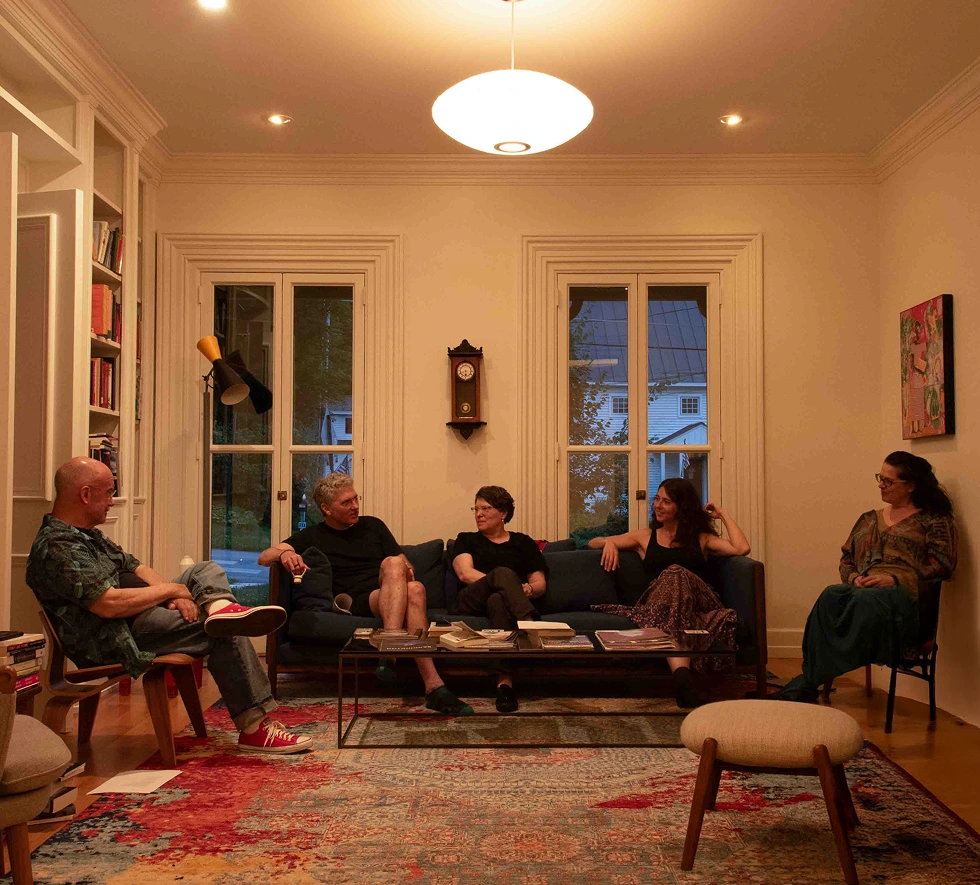 Downstairs libary with group of people talking