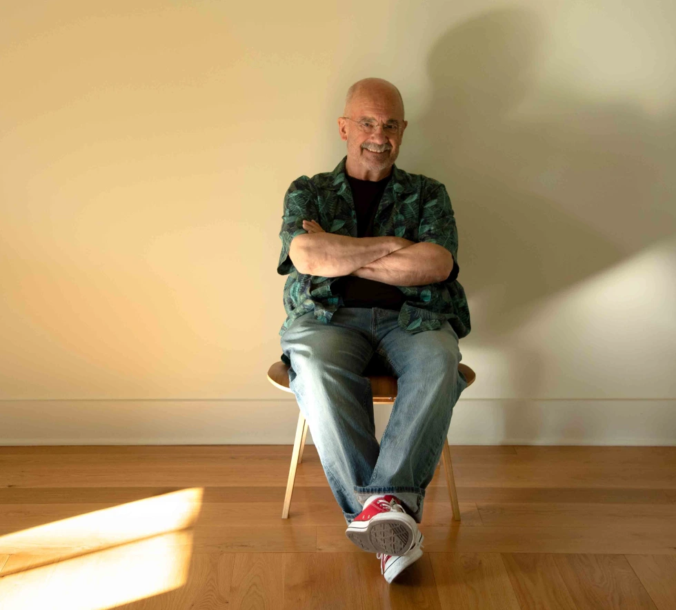 V. Hansmann sitting in chair